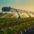 Watering system in the field. An irrigation pivot watering a field.